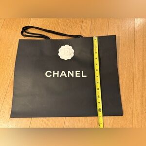 CHANEL Black shopping Bag with White Flower Accent